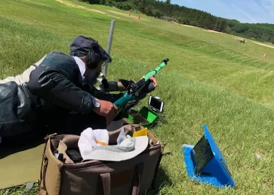 Ray Gross Prone Position Shooting at a Target in a Field with a Rifle