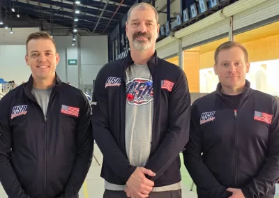 Marty Gunderson with Team USA jacket on with teammates